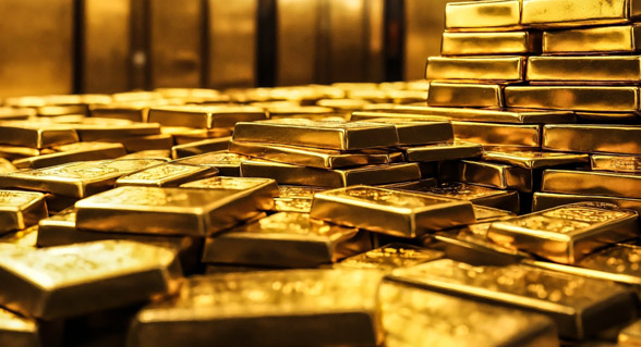 الذهب يهبط مع صعود الدولار واضطرابات المركزي الأمريكي تحد من الخسائر